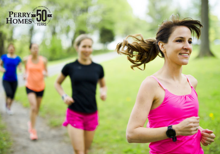 women jogging on community trails